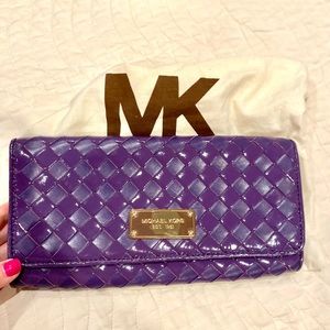 Uh-mazing purple woven patent Michael Kors clutch